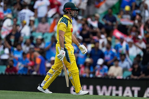 Australia's Mitch Marsh walks off after he is bowled by India's Axar Patel during their One Day International cricket match in Sydney, Australia.