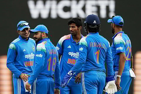 India players celebrates after Virat Kohli, second left, caught out Australia Matthew Short during their One Day International cricket match in Sydney, Australia.