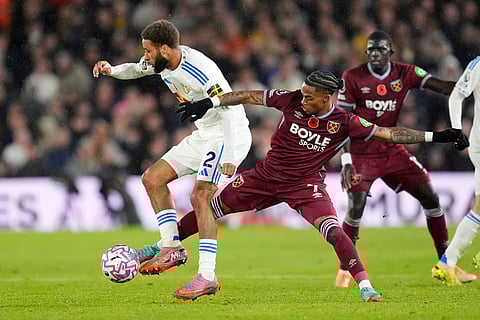 Leeds United's Jayden Bogle, left, and West Ham United's Crysencio Summerville in action during the English Premier League soccer match between Leeds United and West Ham United at Elland Road, Leeds, England.