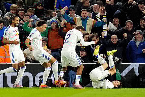 Leeds United's Brenden Aaronson, right, celebrates scoring with teammates during the English Premier League soccer match between Leeds United and West Ham United at Elland Road, Leeds, England.