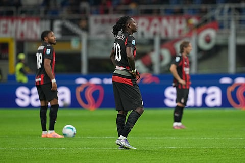 Milan players stand after cencedeing a goal during the Serie A soccer match between AC Milan and Pisa in Milan, Italy.