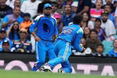 India's Shreyas Iyer, right, catches out Australia's Alex Carey during their One Day International cricket match in Sydney, Australia.
