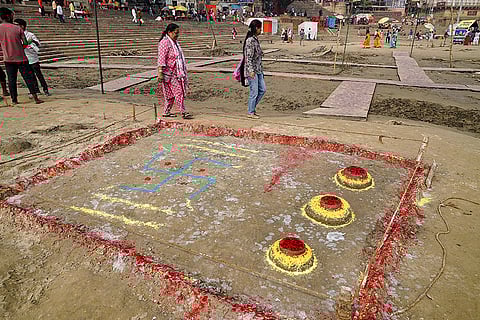 People walk past a decorated ghat after offering prayers on the banks of the Ganges during the first day of the four-day Chhath festival, 'Nahay Khay', in Varanasi.