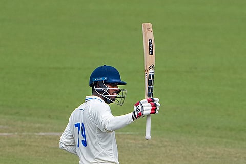 Bengal's Sudip Kumar Gharami celebrates his half-century during the first day of the Ranji Trophy cricket match between Bengal and Gujarat, at Eden Gardens, in Kolkata, West Bengal.