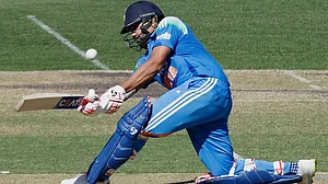 | Photo: AP/James Elsby : India Vs Australia: Rohit Sharma in action during the 2nd ODI.