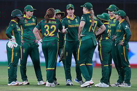 South Africa's players celebrates the wicket of Australia's Beth Mooney during the ICC Women's Cricket World Cup match between Australia and South Africa in Indore.