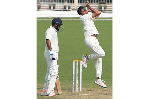 Gujarat's Siddharth Desai bowls during the second day of the Ranji Trophy cricket match between Bengal and Gujarat, at Eden Gardens, in Kolkata, West Bengal.