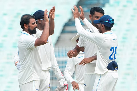 Bengal's Mohammed Shami celebrates with teammates after dismissing Gujarat's Siddharth Desai during the second day of the Ranji Trophy cricket match between Bengal and Gujarat, at Eden Gardens, in Kolkata, West Bengal.