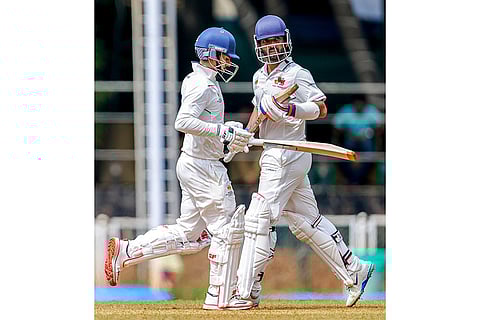 Mumbai’s Ajinkya Rahane and Siddhesh Lad run between the wickets on day one of a Ranji Trophy cricket match between Mumbai and Chhattisgarh, at Sharad Pawar Cricket Academy BKC, in Mumbai.