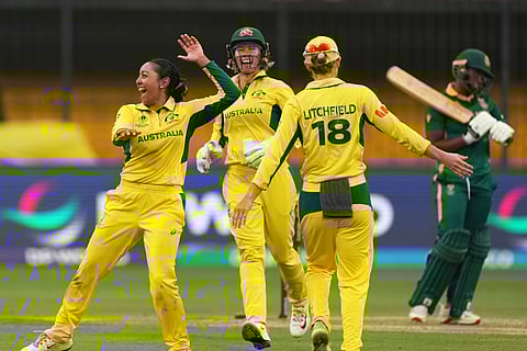 Australia's Alana King, left, celebrates with teammate the wicket of South Africa's Sinola Jafta during the ICC Women's Cricket World Cup match between Australia and South Africa in Indore.