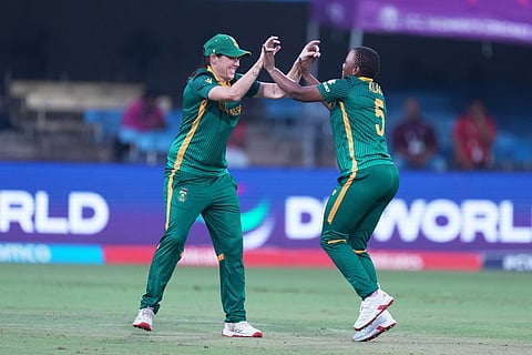 South Africa's Masabata Klaas, right, celebrates with teammate the wicket of Australia's Ellyse Perry during the ICC Women's Cricket World Cup match between Australia and South Africa in Indore.