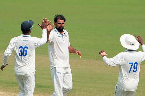 Bengal's Mohammed Shami celebrates with teammates after taking the wicket of Gujarat's Abhishek Desai during the second day of the Ranji Trophy cricket match between Bengal and Gujarat, at Eden Gardens, in Kolkata, West Bengal.