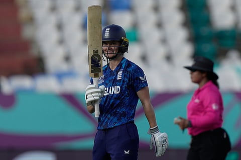 England's Amy Jones celebrates after scoring fifty runs during the ICC Women's Cricket World Cup match between England and New Zealand at ACA–VDCA Cricket Stadium in Visakhapatnam.