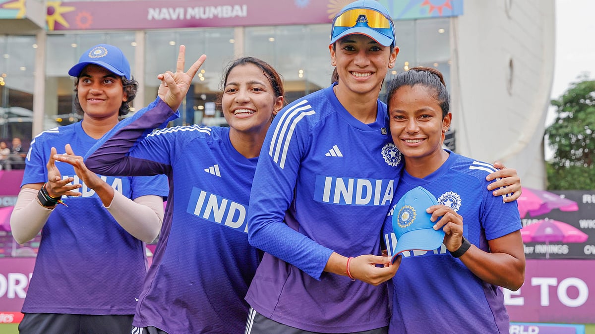 | Photo: X/BCCIWomen : India's vice-captain Smriti Mandhana, centre, hands the first ODI cap to Uma Chetry, right, along with members of the India women's national cricket team at the DY Patil Stadium in Navi Mumbai on October 26, 2025.