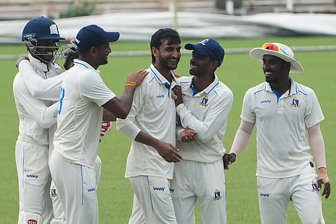Bengal's Shahbaz Ahmed celebrates with teammates after dismissing Gujarat's Jaymeet Manishbhai Patel during the second day of the Ranji Trophy cricket match between Bengal and Gujarat, at Eden Gardens, in Kolkata, West Bengal.