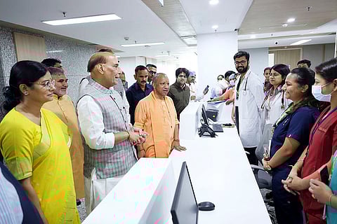 Defence Minister Rajnath Singh, Uttar Pradesh Chief Minister Yogi Adityanath and Union Minister of State for Health and Family Welfare Anupriya Patel during the inauguration of a private hospital, at Indirapuram in Ghaziabad, Uttar Pradesh. 