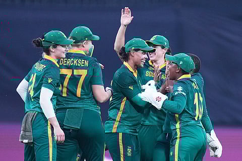 South Africa's players celebrates the wicket of Australia's Ellyse Perry during the ICC Women's Cricket World Cup match between Australia and South Africa in Indore.