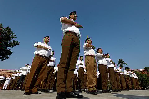 Members of the Rashtriya Swayamsevak Sangh (RSS) take part in an event marking Accession Day celebrations, in Jammu.
