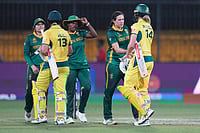 | Photo: AP/Ajit Solanki : Australia's players, wearing yellow, and South Africa's players shake hands after Australia won the match during the ICC Women's Cricket World Cup match between Australia and South Africa in Indore.