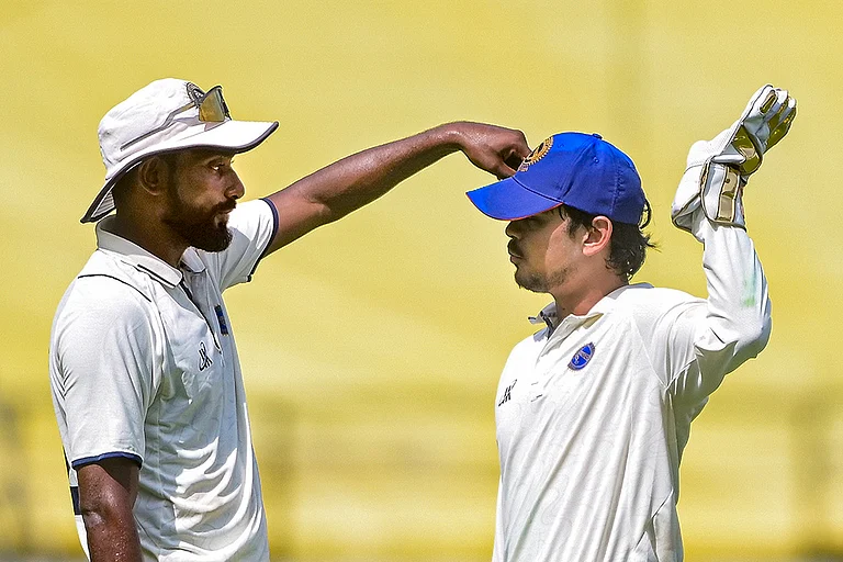 Jharkhand's captain Ishan Kishan, right, with a teammate during the third day of the Ranji Trophy match between Vidarbha and Jharkhand at VCA Stadium, in Nagpur, Maharashtra. - | Photo: PTI
