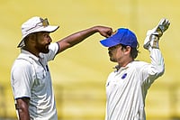 | Photo: PTI : Jharkhand's captain Ishan Kishan, right, with a teammate during the third day of the Ranji Trophy match between Vidarbha and Jharkhand at VCA Stadium, in Nagpur, Maharashtra.
