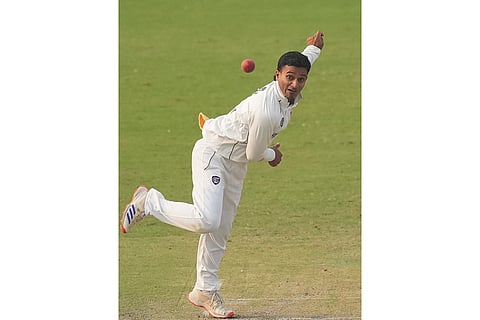Delhi’s captain Ayush Badoni bowls a delivery on day two of a Ranji Trophy cricket match between Delhi and Himachal Pradesh, at Arun Jaitley Stadium, in New Delhi.