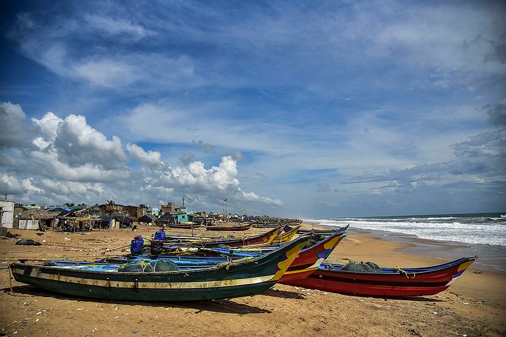 | Photo: PTI : Boats parked on a beach as a precautionary measure against Cyclone Montha
