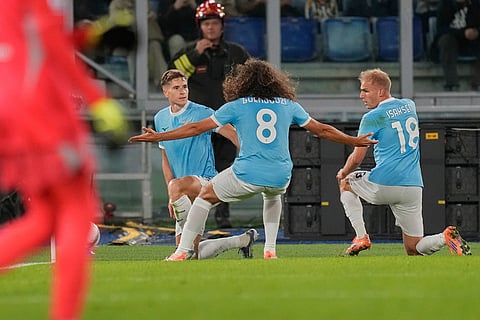 Lazio's Toma Basic, left, celebrates after scoring during the Italian Serie A soccer match between Lazio and Juventus in Rome.