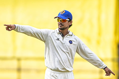 Jharkhand's captain Ishan Kishan sets the field during the third day of the Ranji Trophy 2025-26 cricket match between Vidarbha and Jharkhand, in Nagpur.