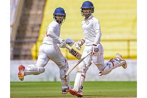 Vidarbha's Aman Mokhade and Atharva Taide sprint between wickets during the third day of the Ranji Trophy match between Vidarbha and Jharkhand at VCA Stadium, in Nagpur, Maharashtra.