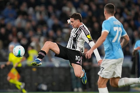 Juventus' Kenan Yildiz goes for the ball during the Italian Serie A soccer match between Lazio and Juventus in Rome.