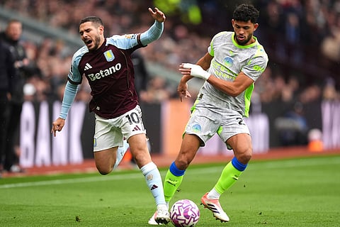 Aston Villa's Emi Buendia (left) and Manchester City's Matheus Nunes battle for the ball during the English Premier League match between Aston Villa and Manchester City, in Birmingham, England.