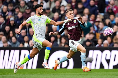 Aston Villa's Lucas Digne (right) and Manchester City's Matheus Nunes battle for the ball during the English Premier League match between Aston Villa and Manchester City, in Birmingham, England.