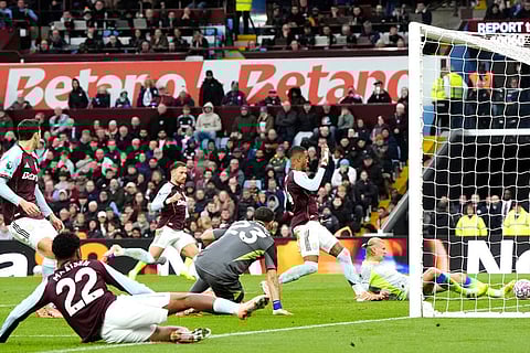 Manchester City's Erling Haaland scores a goal before being ruled out for offside during the English Premier League match between Aston Villa and Manchester City, in Birmingham, England.