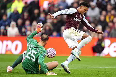 Aston Villa's Ollie Watkins (right) has his shot saved by Manchester City goalkeeper Gianluigi Donnarumma during the English Premier League match between Aston Villa and Manchester City, in Birmingham, England.