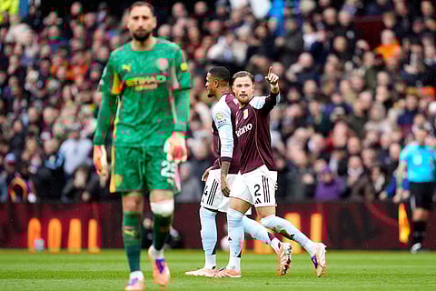 Aston Villa's Matty Cash (right) celebrates scoring his side's first goal during the English Premier League match between Aston Villa and Manchester City, in Birmingham, England.