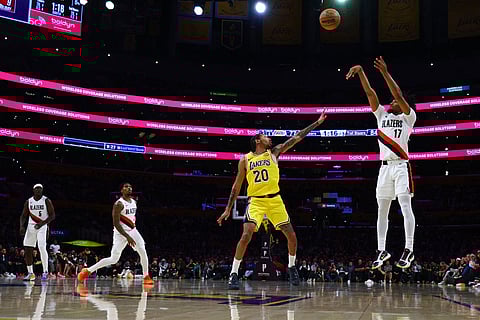Portland Trail Blazers guard Shaedon Sharpe (17) shoots the ball against Los Angeles Lakers guard Nick Smith Jr. (20) during the second half of an NBA basketball game  in Los Angeles.