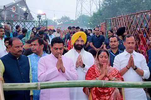 In this image posted on Oct. 28, 2025, Delhi Chief Minister Rekha Gupta with cabinet ministers Manjinder Singh Sirsa, Ravinder Singh (Indraj) and Kapil Mishra offers prayers on the last day of the 'Chhath Puja' festival celebrations, at Hathi ghat, in New Delhi.  ()(PTI10_28_2025_000057B)