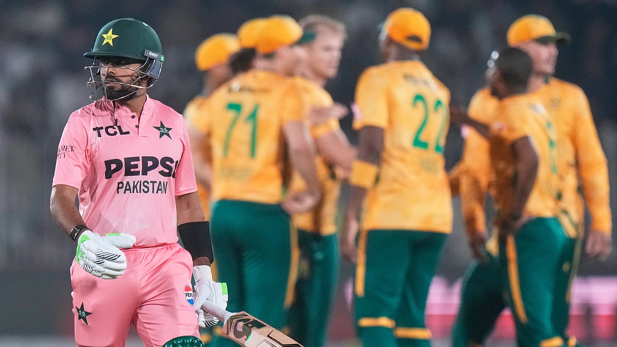 AP Photo/Anjum Naveed : Pakistan's Babar Azam, left, walks off the field as South African players celebrates after his dismissal during the first T20 cricket match between Pakistan and South Africa, in Rawalpindi, Pakistan, Tuesday, Oct. 28, 2025