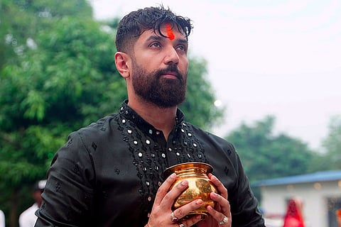 Union Minister Chirag Paswan performs rituals on the last day of the ‘Chhath Puja’ festival, in Patna.