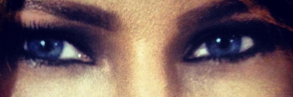 A close-up, cropped view of blue eyes from a digital image