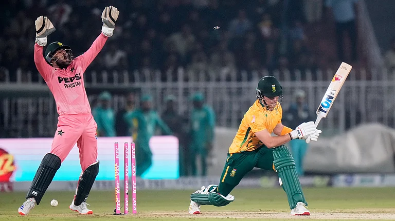 Dewald Bravis, right, is bowled out by Pakistan's Mohammad Nawaz during the first T20 cricket match between Pakistan and South Africa, in Rawalpindi. - AP