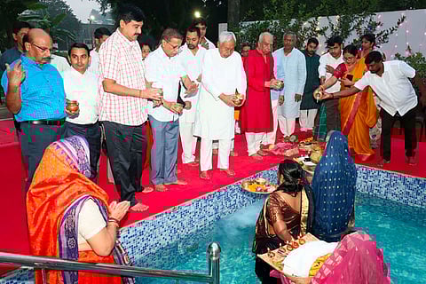 Bihar Chief Minister Nitish Kumar performs rituals on the last day of the ‘Chhath Puja’ festival celebrations, in Patna.