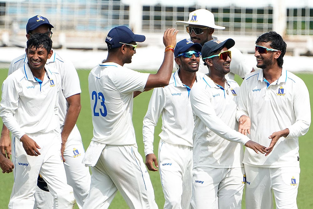 Photo: PTI/Swapan Mahapatra : Bengal's Shahbaz Ahmed with teammates celebrates the wicket of Gujarat's Manan Hingrajia during the fourth day of the Ranji Trophy 2025-26 cricket match between Bengal and Gujarat, at Eden Gardens, in Kolkata,