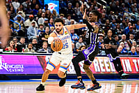 | Photo: AP/Gerald Leong : Oklahoma City Thunder guard Ajay Mitchell (25) drives pass Sacramento Kings guard Keon Ellis (23) during the second half of an NBA basketball game between Sacramento Kings and Oklahoma City Thunder in Oklahoma City. 