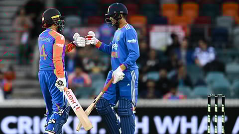 Abhishek Sharma, left, of India and teammate Shubman Gill gesture during the T20 cricket international between India and Australia in Canberra, Australia, Wednesday, Oct. 29, 2025.