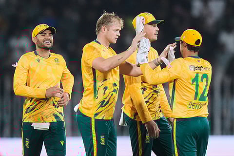 South Africa's Corbin Bosch, second left, celebrates with teammates after taking the wicket of Pakistan's Salman Ali Agha during the first T20 cricket match between Pakistan and South Africa, in Rawalpindi, Pakistan.