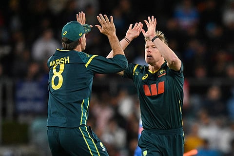 Josh Inglis, right, of Australia celebrates with teammate Mitchell Marsh after dismissing Abhishek Sharma of India during the T20 cricket international between India and Australia in Canberra, Australia.