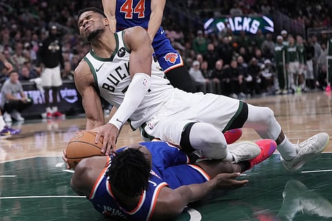 Milwaukee Bucks' Giannis Antetokounmpo is fouled by New York Knicks' OG Anunoby during the second half of an NBA basketball game in Milwaukee. 