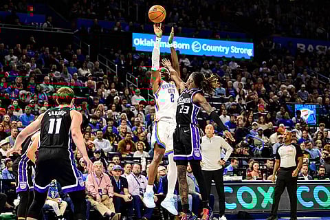 Oklahoma City Thunder guard Shai Gilgeous-Alexander (2) shoots against Sacramento Kings guard Keon Ellis (23) during the second half of an NBA basketball game in Oklahoma City. 